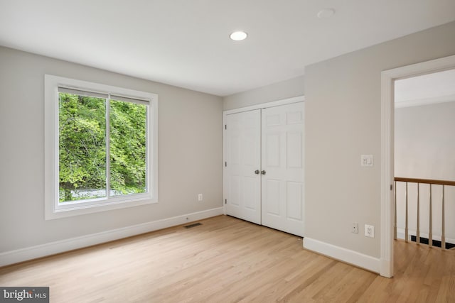 6530 Heather Brook Ct, Mclean, VA 22101 - unfurnished bedroom featuring light wood-style flooring, recessed lighting, baseboards, visible vents, and a closet