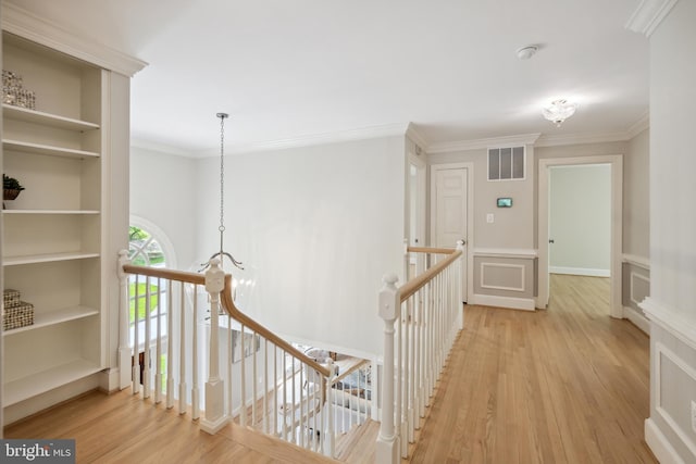 6530 Heather Brook Ct, Mclean, VA 22101 - hall with an upstairs landing, ornamental molding, wood finished floors, and visible vents