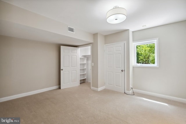 6530 Heather Brook Ct, Mclean, VA 22101 - unfurnished bedroom with baseboards, light colored carpet, visible vents, and a closet