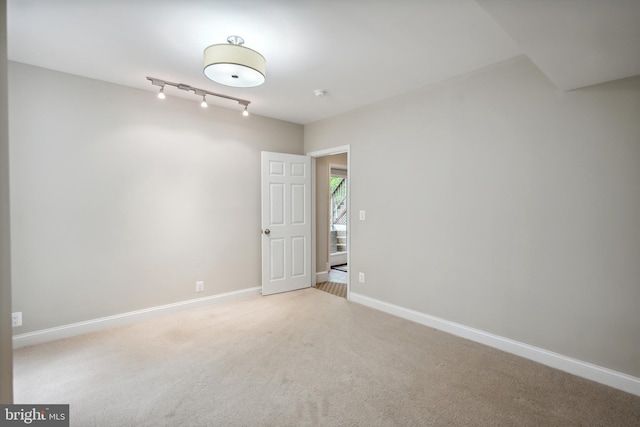 6530 Heather Brook Ct, Mclean, VA 22101 - unfurnished room with track lighting, baseboards, and light colored carpet