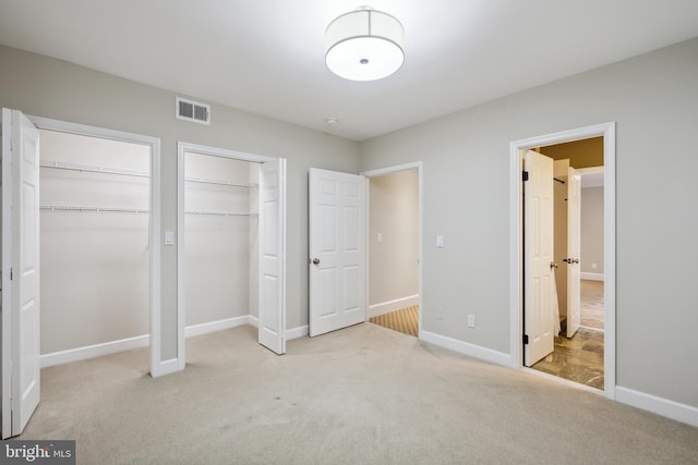 6530 Heather Brook Ct, Mclean, VA 22101 - unfurnished bedroom featuring visible vents, baseboards, multiple closets, and carpet