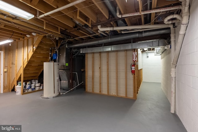6530 Heather Brook Ct, Mclean, VA 22101 - unfinished basement featuring concrete block wall, heating unit, and electric water heater