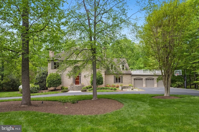 6530 Heather Brook Ct, Mclean, VA 22101 - view of front of property with a chimney, an attached garage, driveway, and a front yard