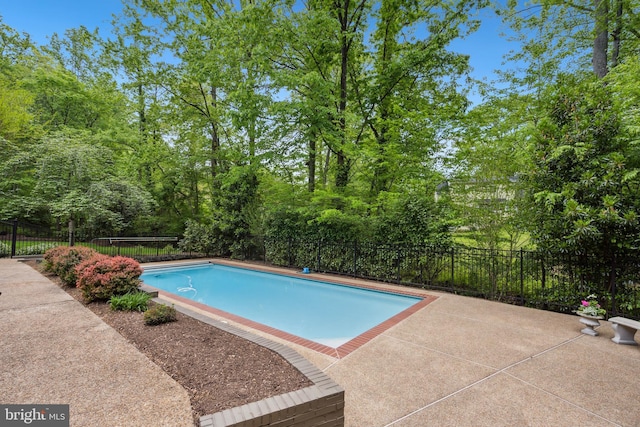 6530 Heather Brook Ct, Mclean, VA 22101 - view of swimming pool featuring a fenced in pool, fence, and a patio