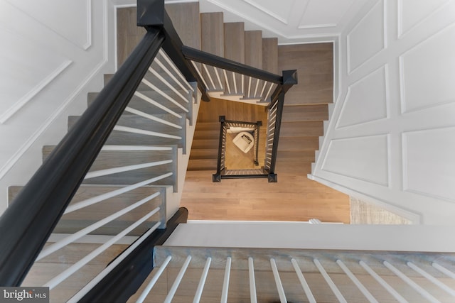 staircase with wood finished floors