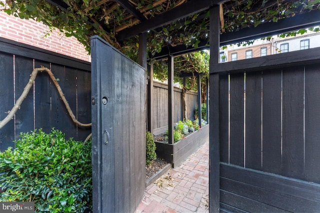 view of gate featuring a vegetable garden