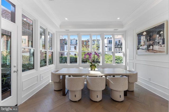 sunroom / solarium with recessed lighting, a tray ceiling, ornamental molding, and a decorative wall