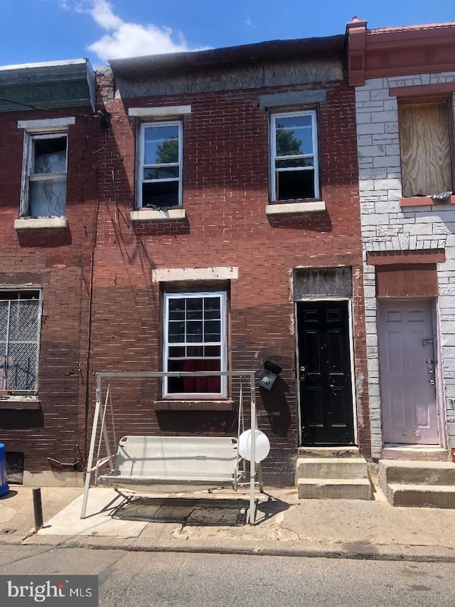multi unit property featuring brick siding