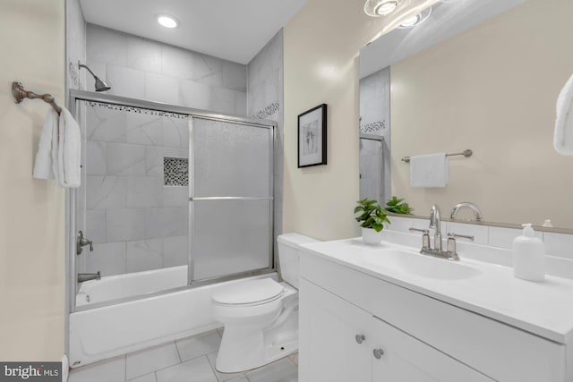 full bath with combined bath / shower with glass door, toilet, recessed lighting, vanity, and tile patterned flooring