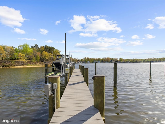view of dock with a water view and boat lift