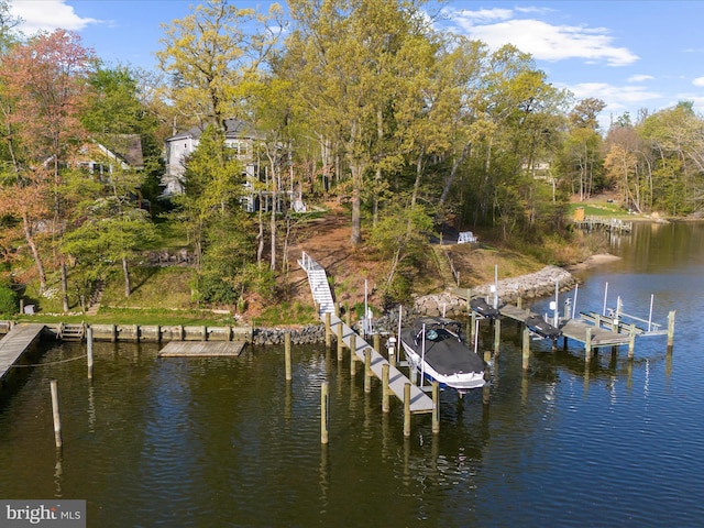 dock area featuring boat lift and a water view