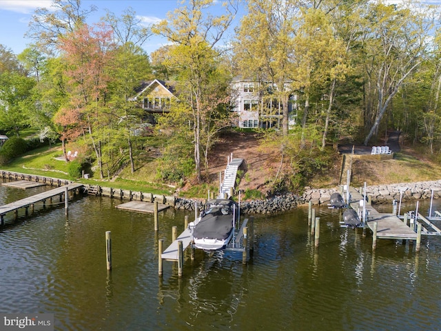 view of dock with boat lift and a water view