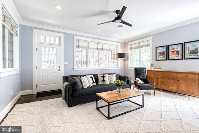 living room with a ceiling fan, crown molding, baseboards, light wood finished floors, and recessed lighting