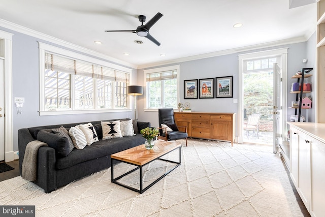 living room with crown molding, recessed lighting, ceiling fan, and light colored carpet