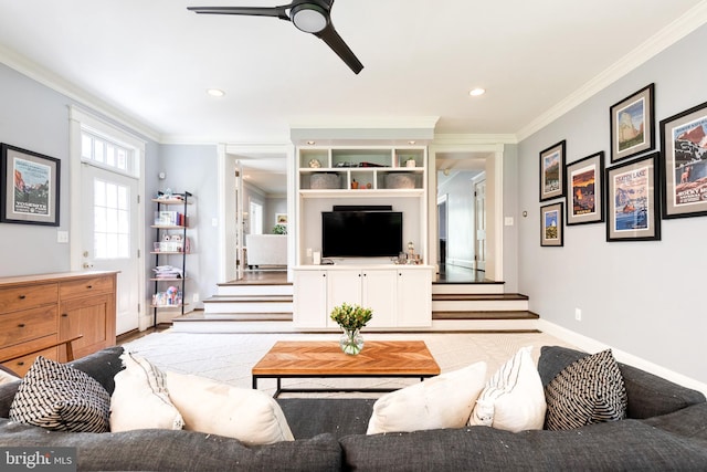 living area featuring crown molding, ceiling fan, recessed lighting, baseboards, and stairway
