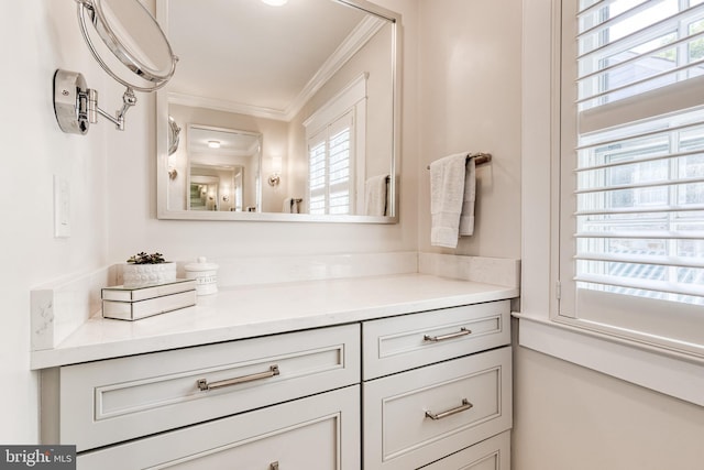 bathroom featuring vanity and ornamental molding