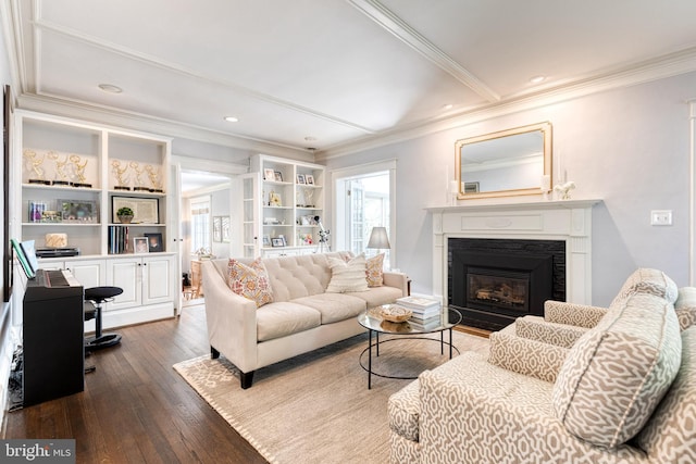 living area with crown molding, a premium fireplace, recessed lighting, and dark wood-type flooring