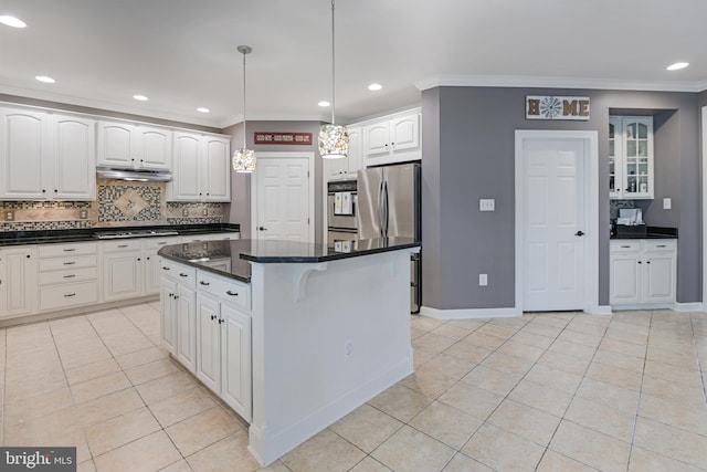 kitchen with a center island, tasteful backsplash, light tile patterned floors, ornamental molding, and stainless steel appliances
