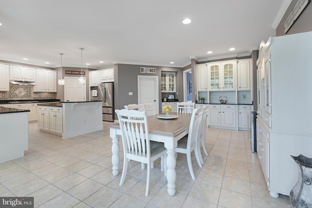 dining room with recessed lighting, ornamental molding, and light tile patterned floors