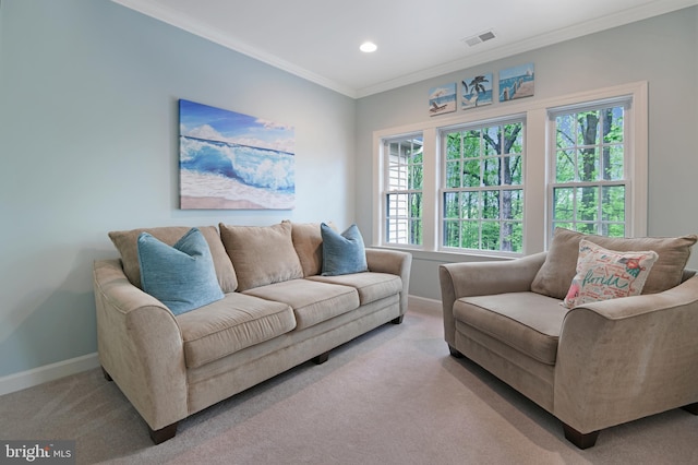 living area featuring visible vents, baseboards, ornamental molding, light carpet, and recessed lighting
