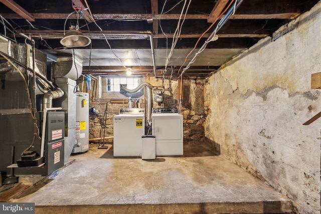 basement with gas water heater, heating unit, and washer and clothes dryer