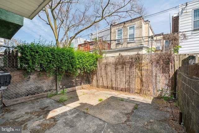 view of yard featuring a patio and fence