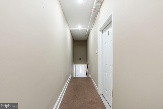 hall featuring carpet flooring, recessed lighting, baseboards, and attic access
