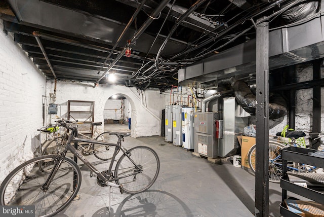 unfinished basement featuring electric water heater
