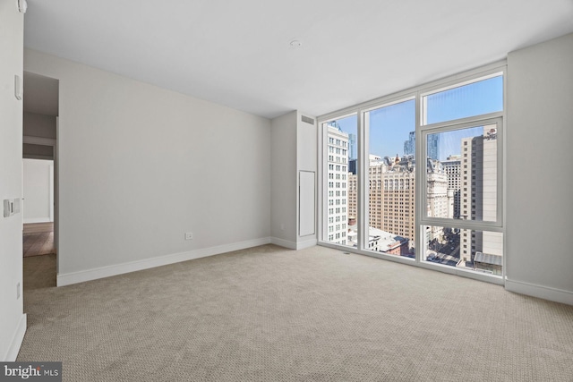 301 S Broad St Unit 1901-2, Philadelphia, PA 19107 - carpeted spare room featuring baseboards, floor to ceiling windows, and a view of city