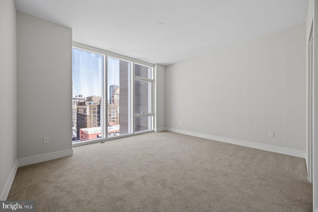 301 S Broad St Unit 1901-2, Philadelphia, PA 19107 - carpeted spare room with a city view and baseboards