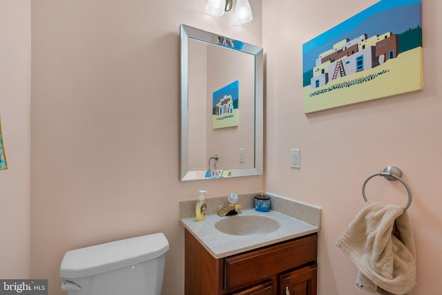 bathroom with toilet and vanity