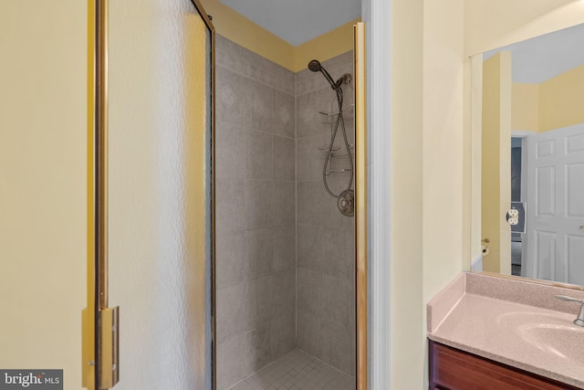 bathroom featuring a stall shower and vanity