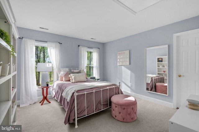 bedroom featuring baseboards, visible vents, and carpet