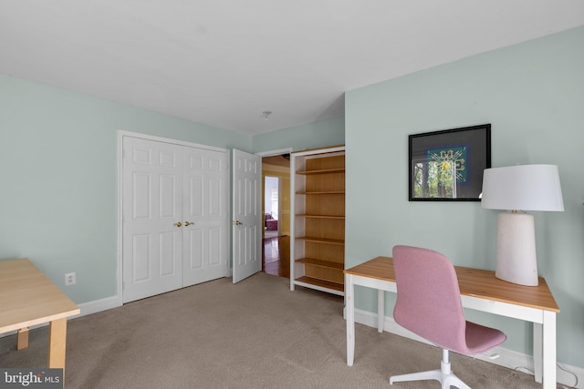 office with baseboards and carpet floors