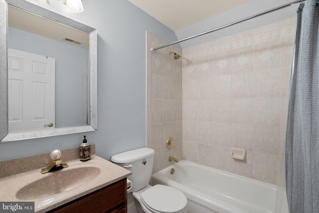 bathroom featuring visible vents, toilet, shower / bath combination with curtain, and vanity