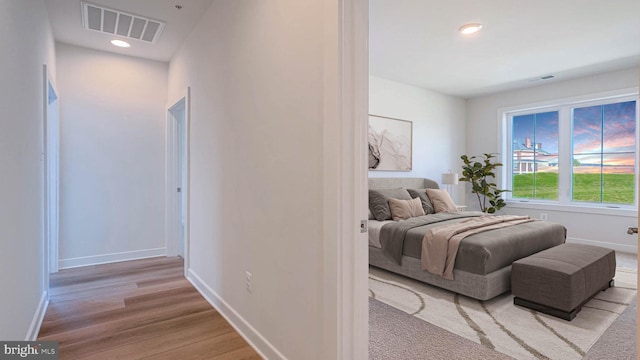 bedroom featuring visible vents, recessed lighting, baseboards, and light wood finished floors