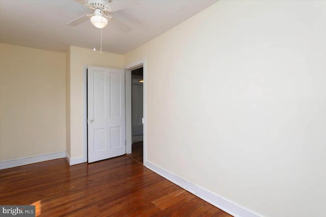 unfurnished bedroom featuring wood finished floors, baseboards, and a ceiling fan
