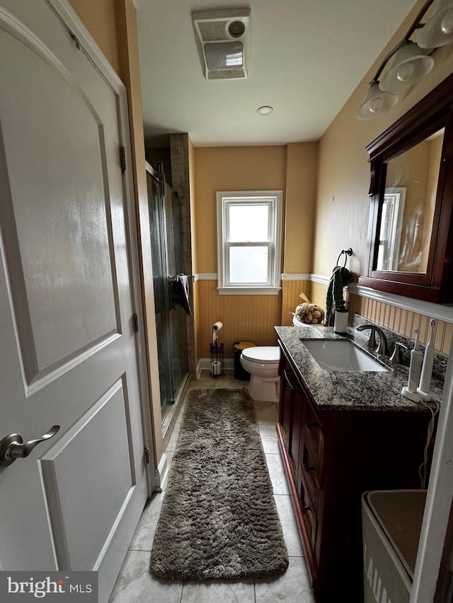 766 President, Lawrenceville, NJ 08648 - bathroom with toilet, a wainscoted wall, vanity, and a stall shower