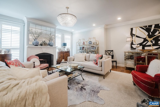 living area featuring a notable chandelier, wood finished floors, baseboards, ornamental molding, and recessed lighting