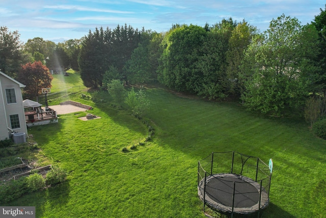 view of yard with cooling unit and a fire pit