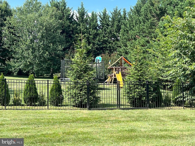 view of yard with fence and playground community