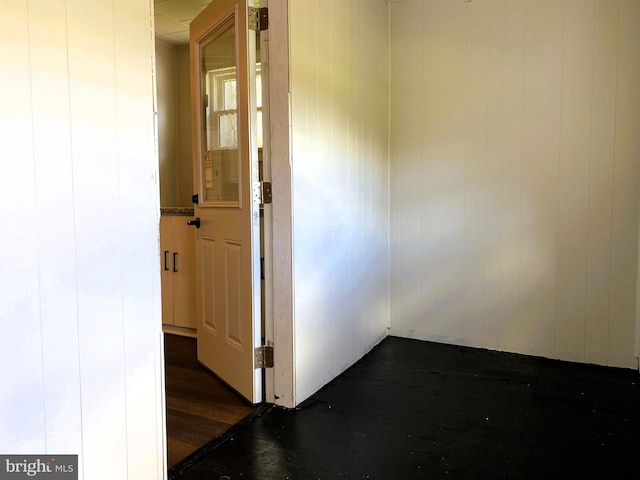 hallway featuring dark wood finished floors