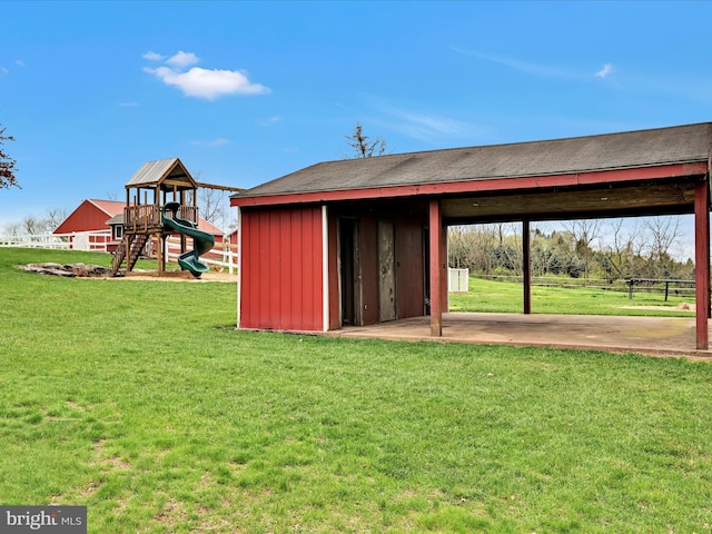 view of outbuilding featuring an outbuilding and a playground