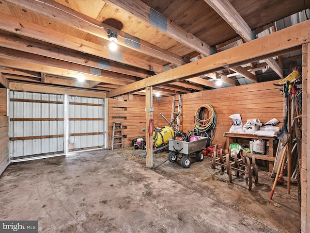 garage with wood walls