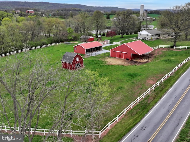 birds eye view of property featuring a rural view