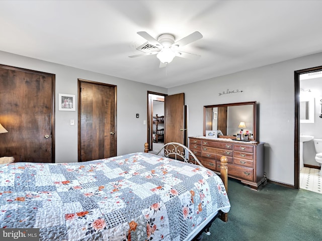 bedroom featuring multiple closets, dark colored carpet, a ceiling fan, baseboards, and ensuite bathroom