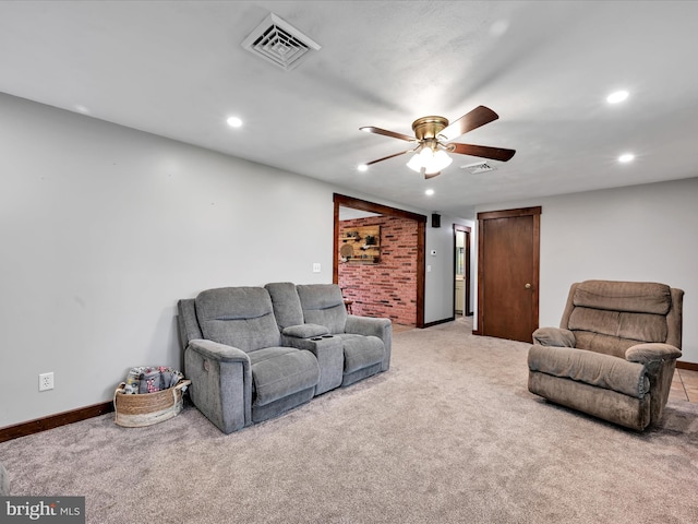 living area with ceiling fan, light carpet, baseboards, visible vents, and recessed lighting