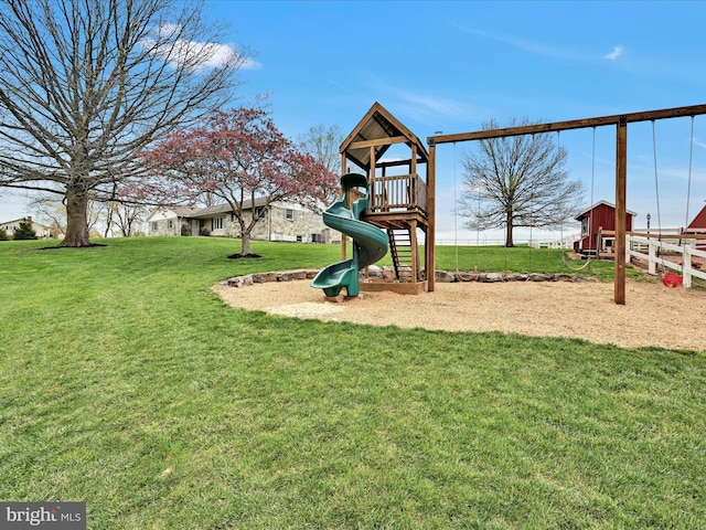 communal playground with fence and a yard