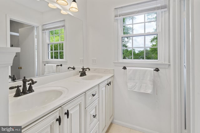 full bathroom featuring a sink, tile patterned flooring, and double vanity