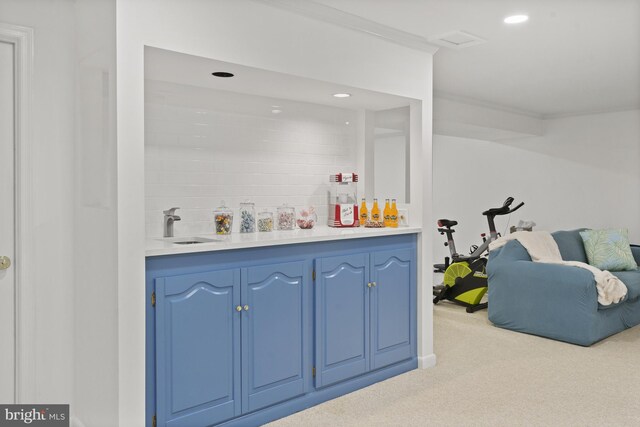 bar with ornamental molding, a bar, recessed lighting, and light colored carpet